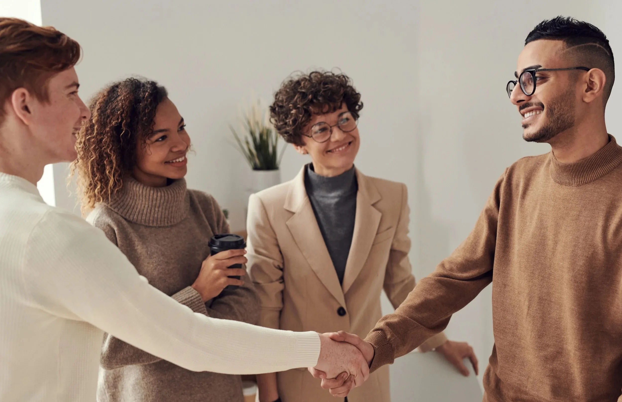 Fellows greeting one another before a working session